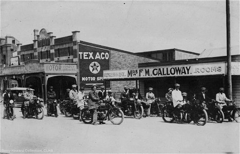 Cessnock Motorcycle Club outside E. A. Sternbeck & Son Motor Service Station, and Mrs F. M. Galloway's Refreshment Rooms. Cessnock, NSW, 1924 photo