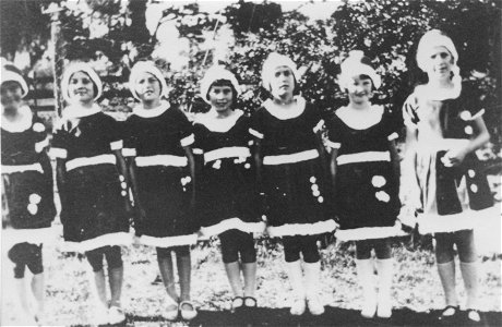 Seven young girls in costumes, possibly for a Christmas performance, [n.d.]