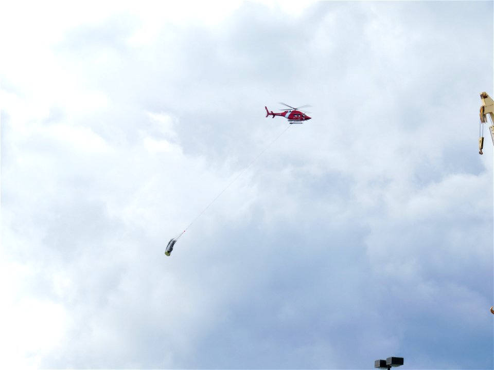 Coast Guard helicopter with rescue basket