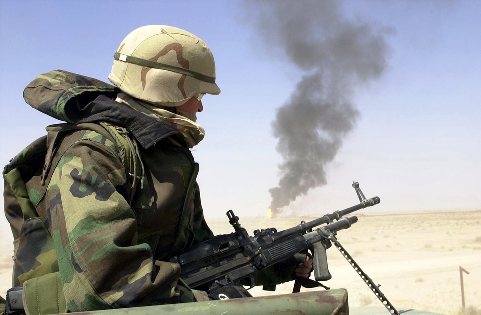 mans an M-60E3 7.62mm machine gun