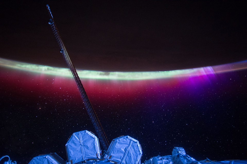 Auroras Colorful Veil Over Earth