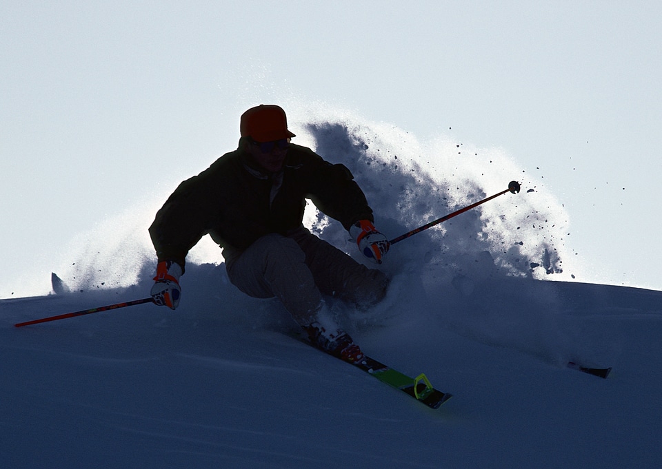 Silhouette of a skier on the hill