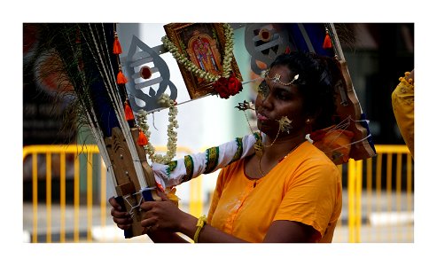 Thaipusam procession in Singapore- women with piercings are not common photo