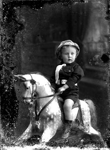 Small boy on rocking horse, [n.d.]