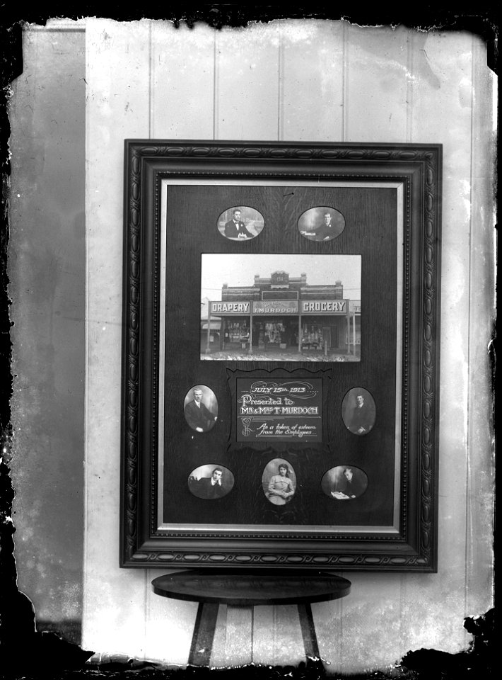 Plaque showing T. Murdoch, Drapery and Grocery, presented to T. Murdoch by his employees as a token of their esteem, [n.d.]