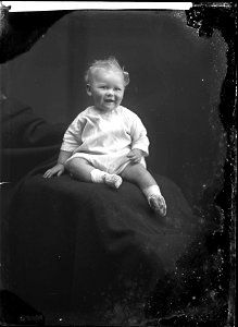Baby on a cushion, n.d.