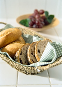 Fresh Bread and graph on a Plate on Top of Wooden Table photo