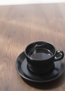 Coffee cup top view on wooden table background photo