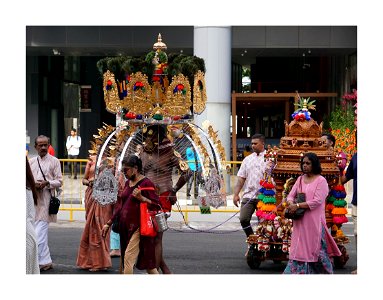 Thaipusam procession - men will carry kavadi (and some will be pulling heavy load) photo