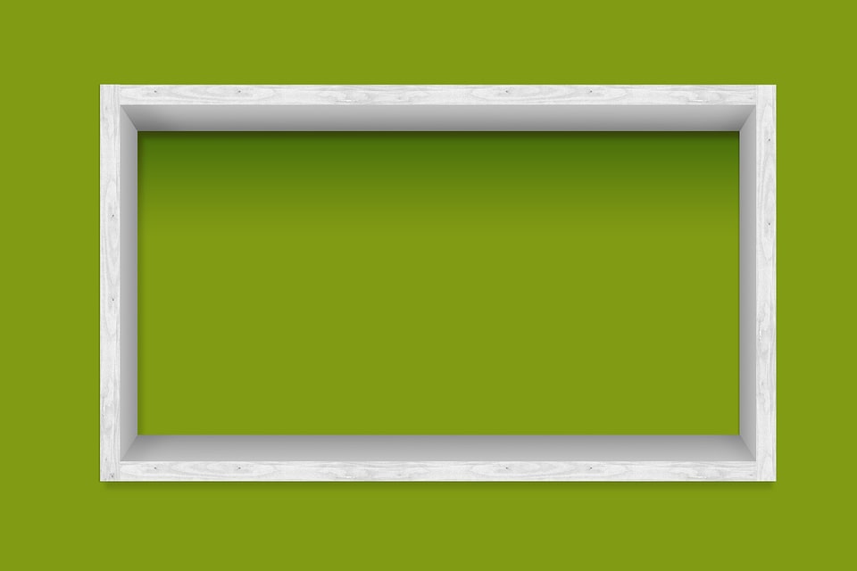 white frames on the green wall