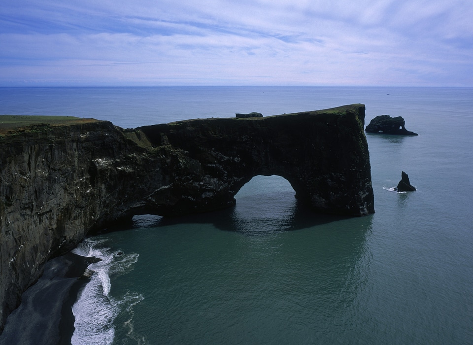 Dyrholaey a famous rock with a hole in it in Iceland