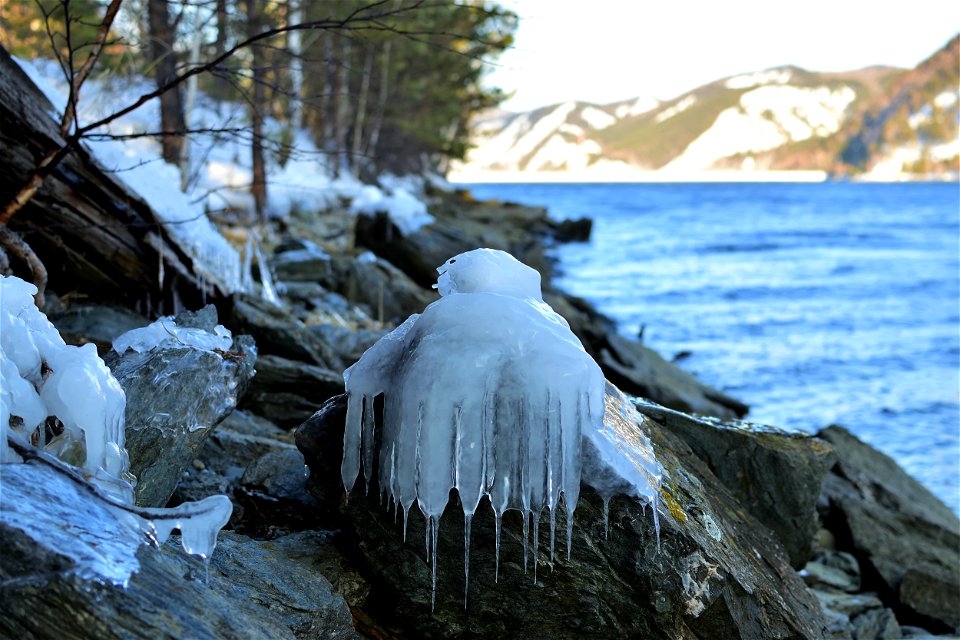 winter road along the river and mountains