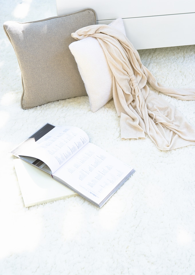 Composition with warm plaid, book