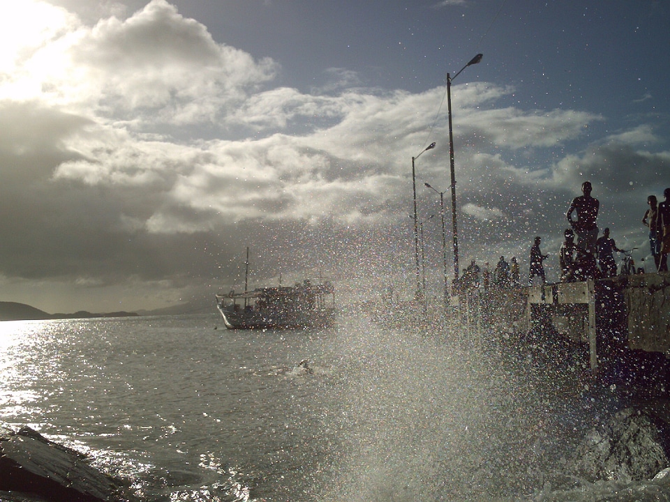 Pier seen through wave splash photo