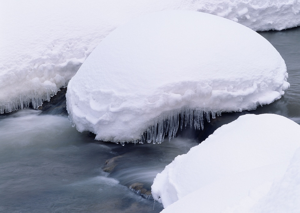 Frozen mountain river, with snow and ice