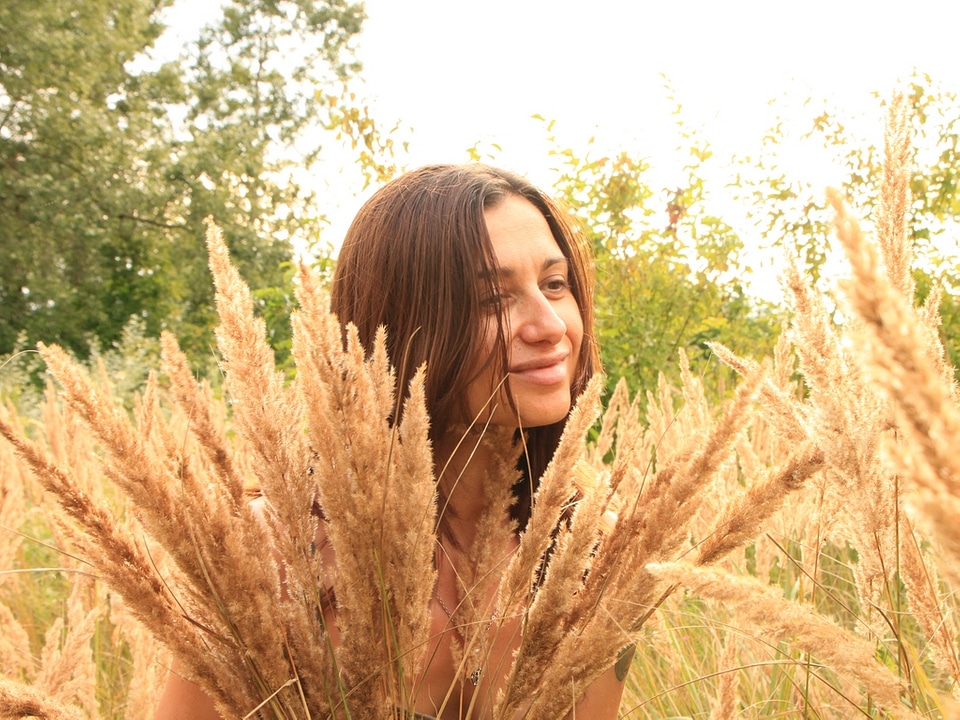 Woman In Tall Grass