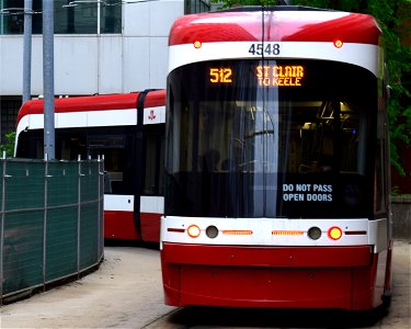 TTC 512 Streetcar 4548 moving to the loading platform at St.Clair. photo