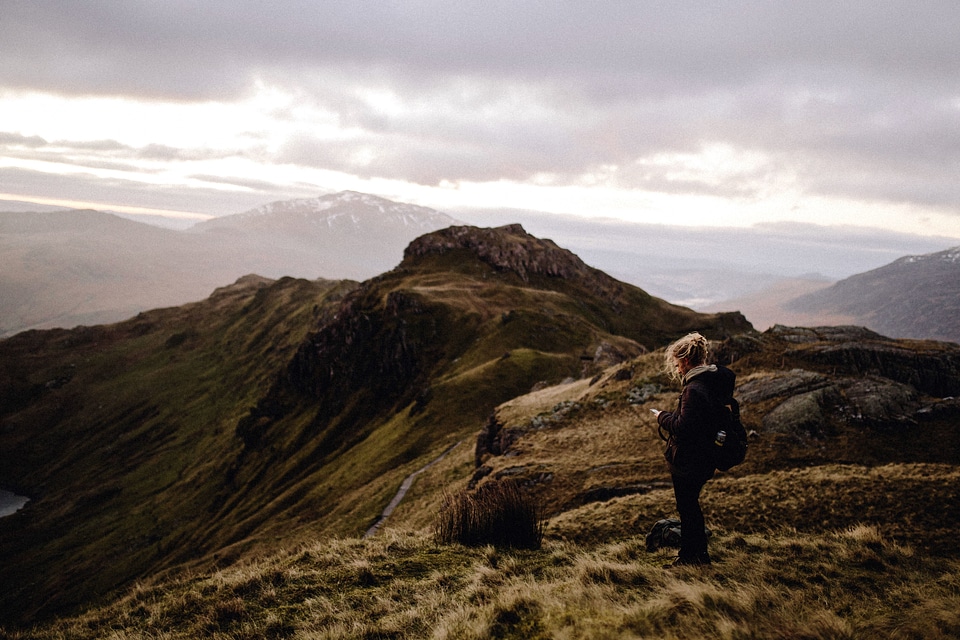 woman hiker hiking on mountain peak