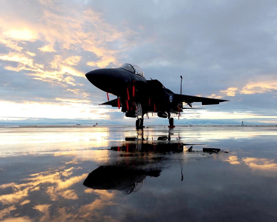 F-15E Fighter Jet On A Runway At Sunset