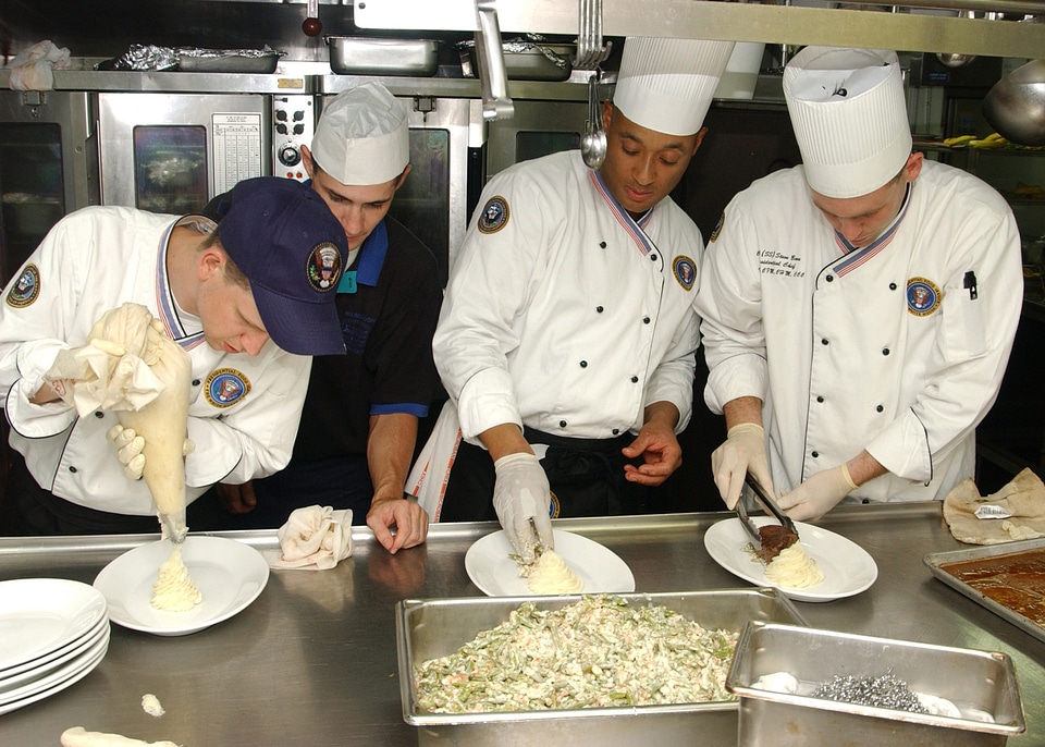 Helpers preparing food