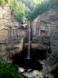 Magnificent waterfall dropping over shale cliffs photo