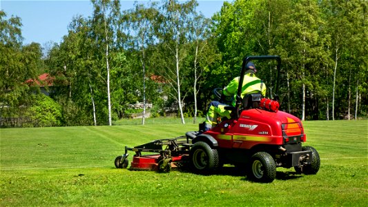 Riding mower in the north soccer field in Brastad 1 photo