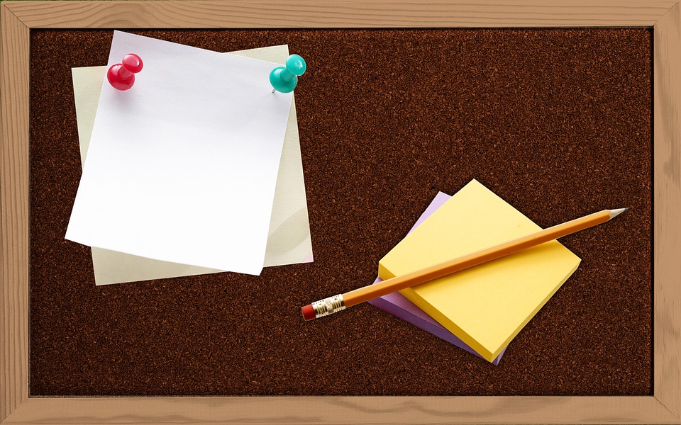 cork board with blank notes