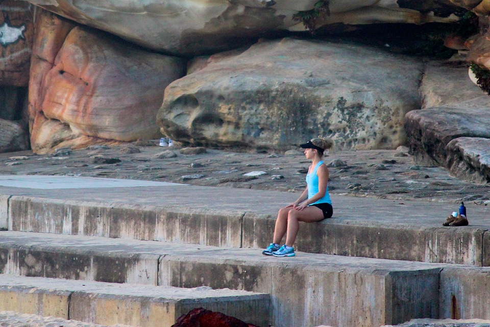 young serious woman near river
