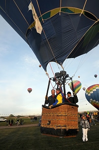 Tourist in an Hot Air Balloon over the plain photo