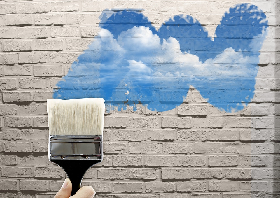 paint brushes drawing on the wall