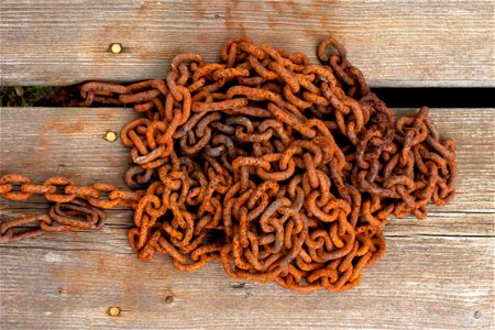 Rusty chain on wooden deck in Loddebo photo