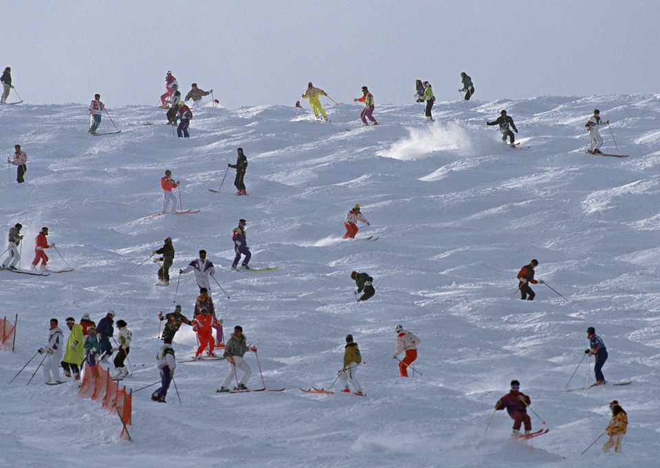 Skiers at the beginning of a ski slope