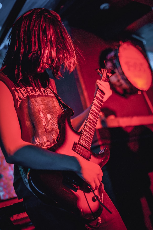 Musicians hands, playing guitar