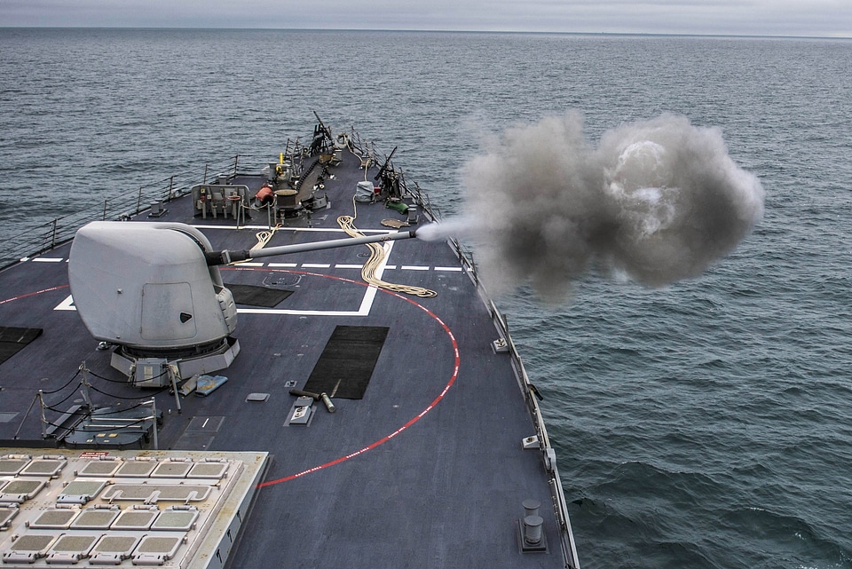 A Mark 45 5-inch gun fires