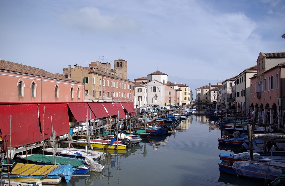 Old wooden boats in the canal Chioggia, Italy