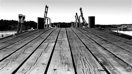 Long jetty with ladders in Govik - bw photo