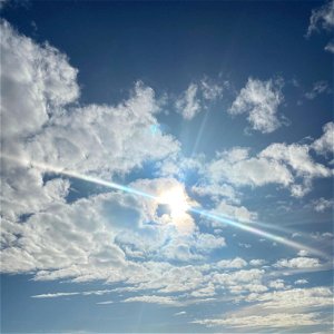 Sky with clouds and sun photo