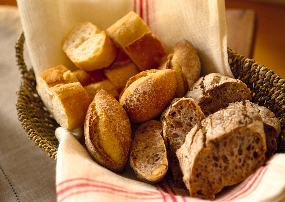 bread and rolls in wicker basket