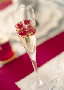 Raspberries in champagne glass photo