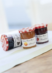 Blueberry, strawberry and orange fruit bottled jam photo