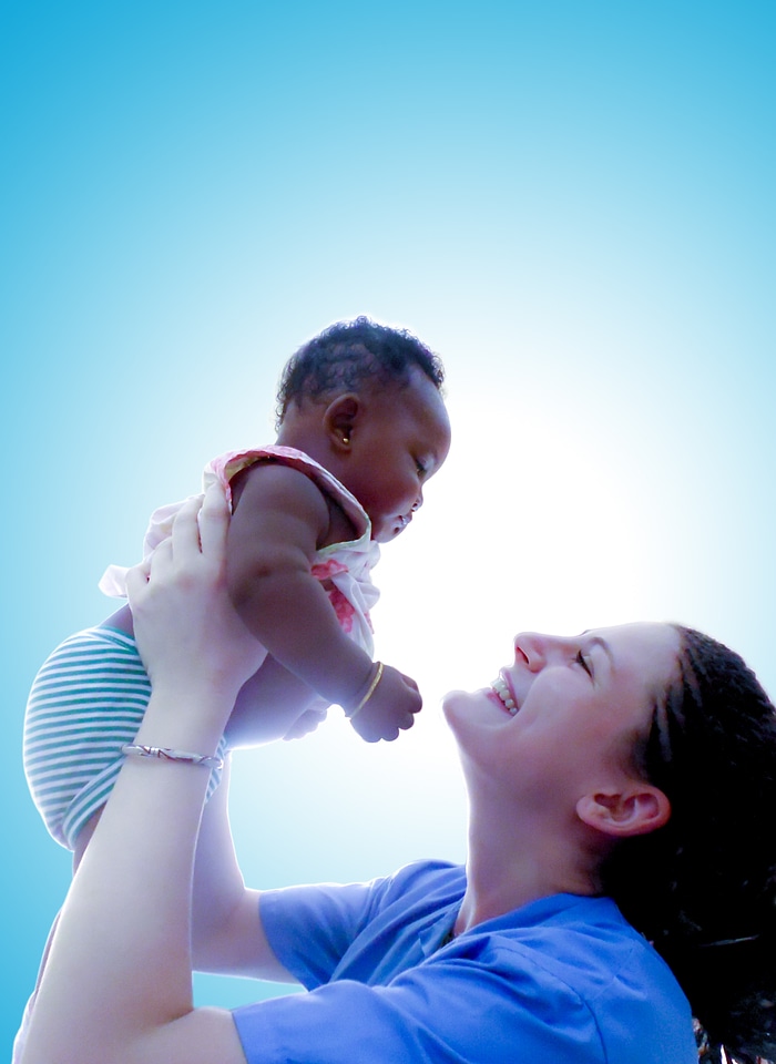 Holding happy infant