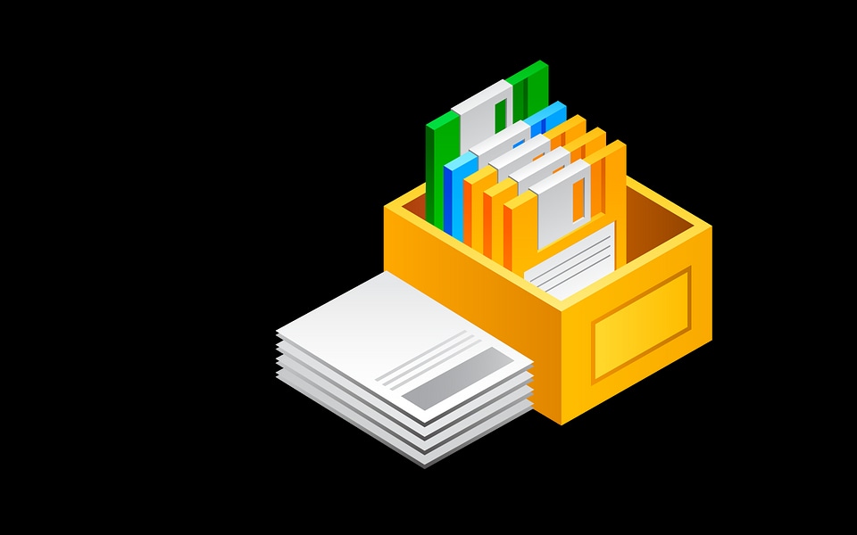 Office supplies in open desk drawer