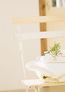 Branches of rosemary and towels close up