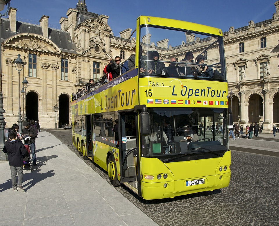 A tourist bus in front of the Louvre, Paris