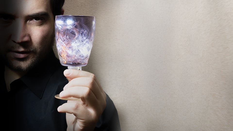 man holding wine glass