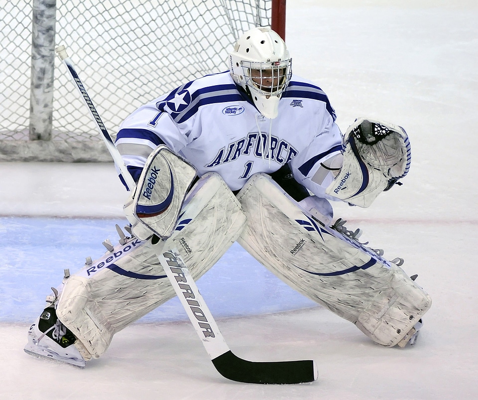 Ice hockey goalie in front of his net