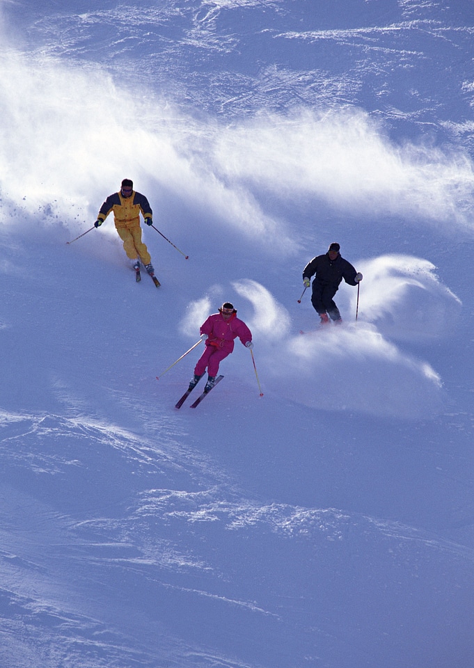 Alpine skier skiing downhill