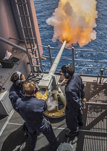 Gunner's mates fire a 40mm saluting battery