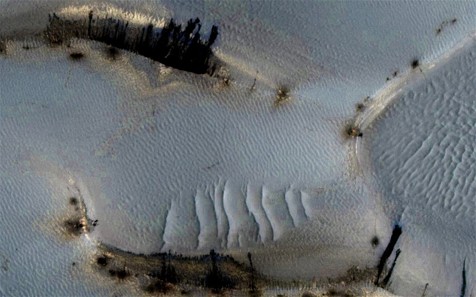 Mars - Falling Material Kicks Up Cloud of Dust on Dunes