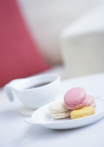 A cup of coffee and macaron photo